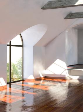 Sun coming through large arched windows in empty room.
